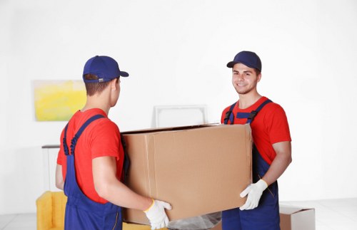 Man and van removals team loading furniture for a local move in Maryland