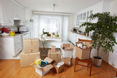 Packed office boxes and labeled equipment for a Maryland business move
