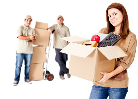 Moving team handling furniture during a house move